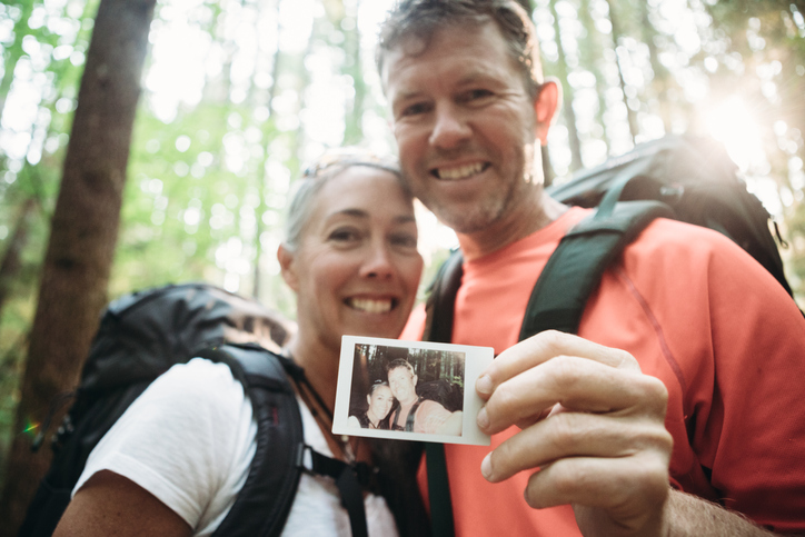 Mature Couple Backpacking in Forest