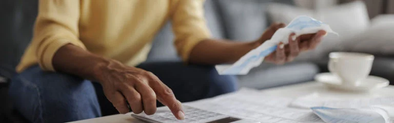 mid adult woman checking her bills at home