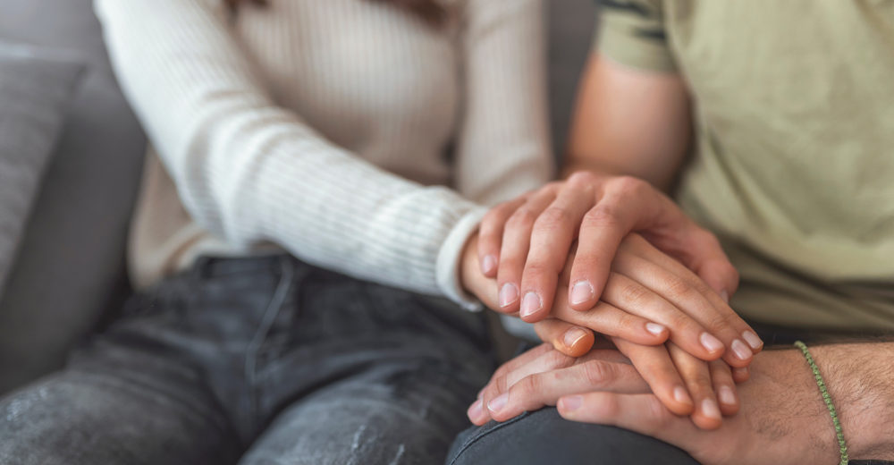 Shot Of Couple Holding Hands