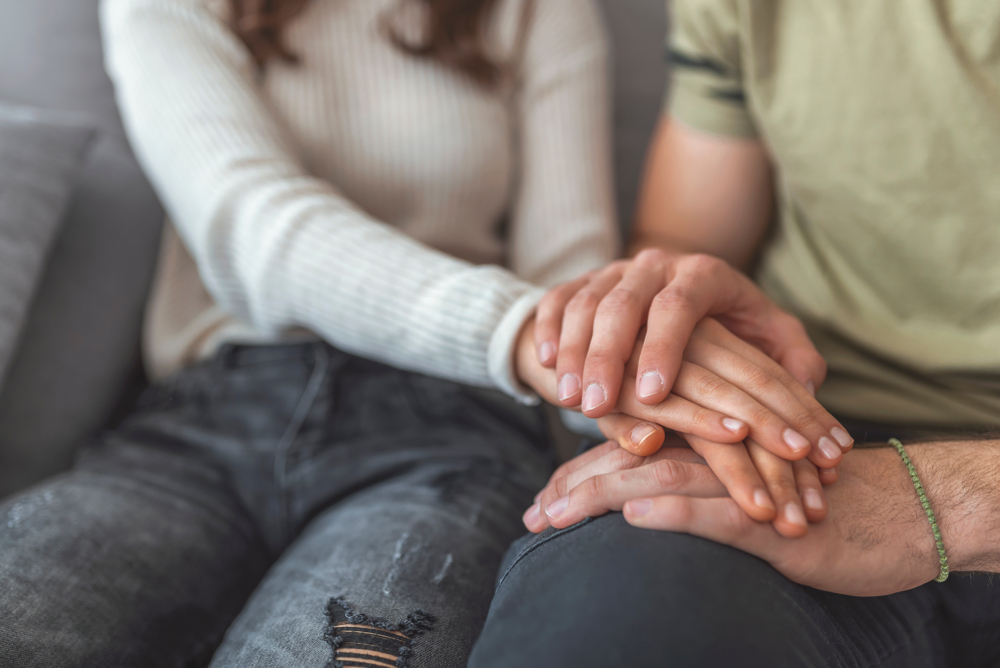 Shot Of Couple Holding Hands