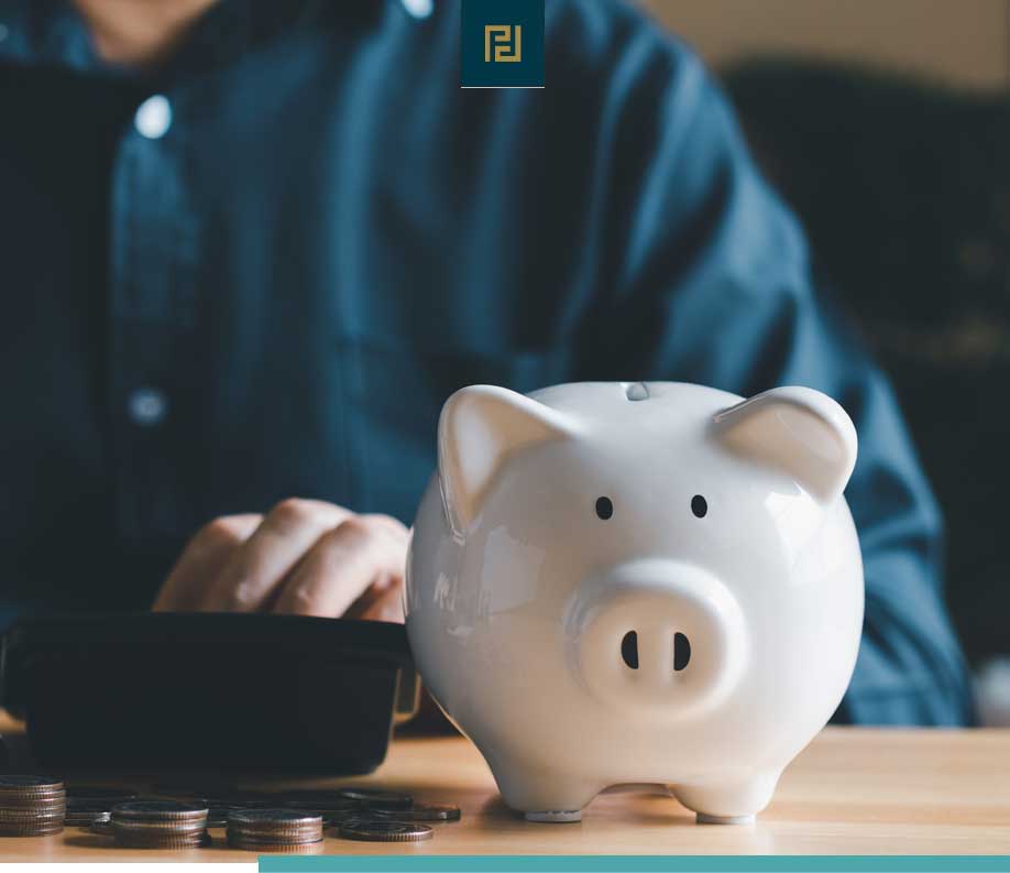 man at desk with piggy bank. financial concepts