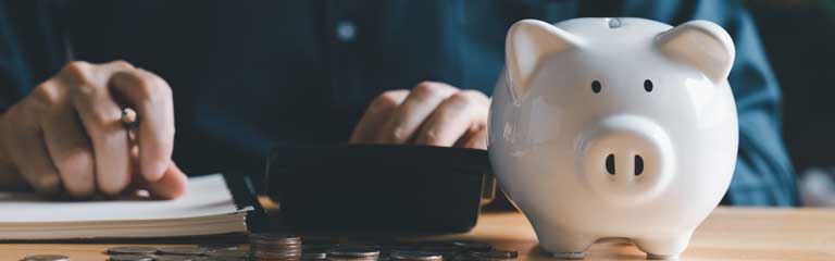 man at desk with piggy bank. financial concepts