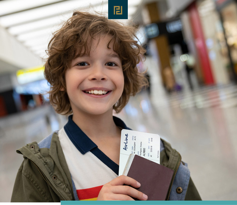 A young boy, navigating child custody when one parent is a non-US citizen, tightly clutching a passport and a ticket.
