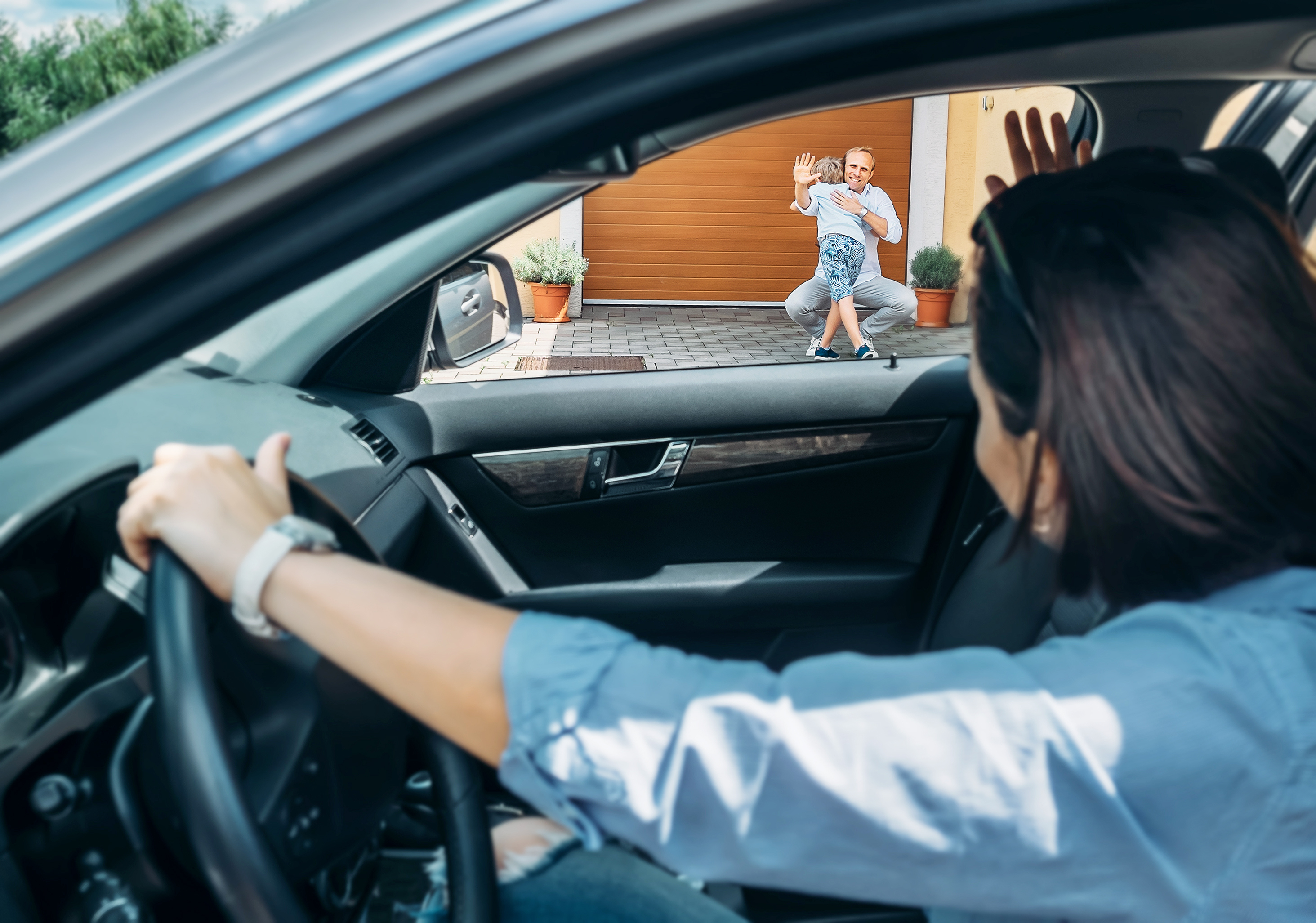 A parent drops off child with father for parenting time