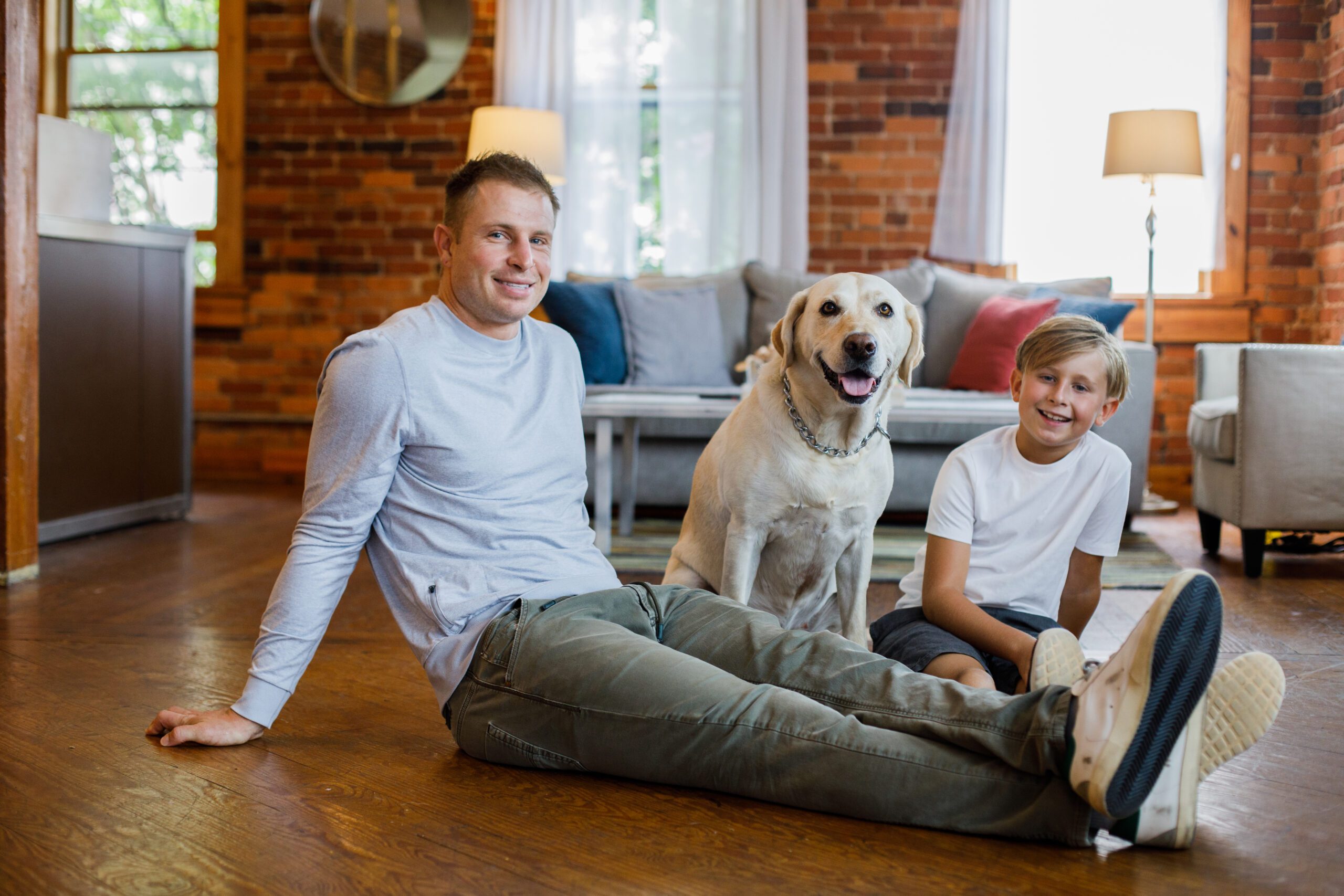 A father with his dog and child