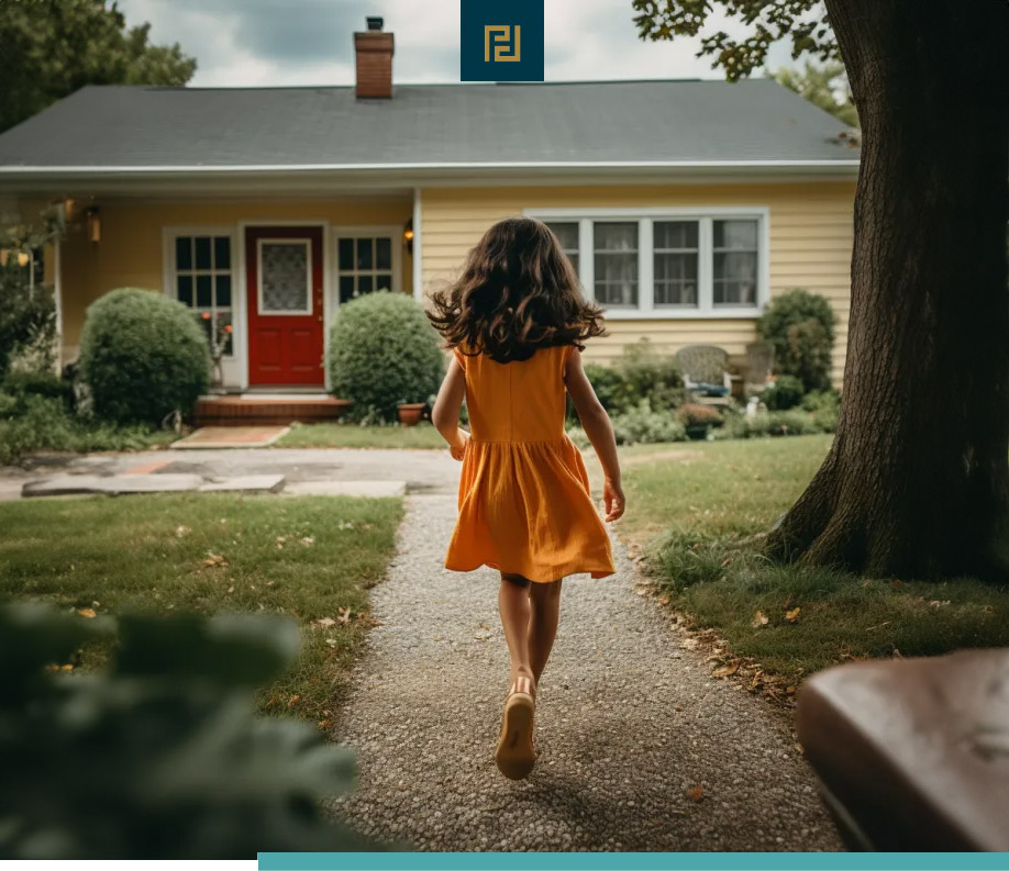 A girl in a yellow dress walking down a path in front of a house