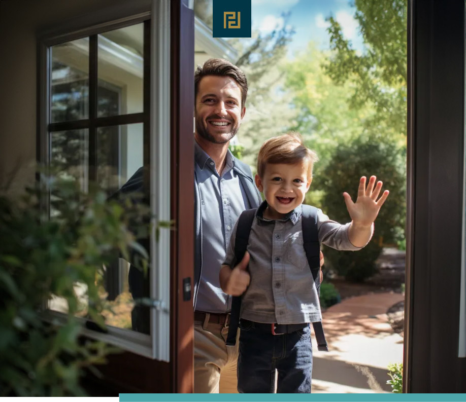 A man and a child standing in the doorway of their home